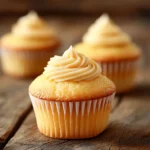Close-up of golden, tender Mini Cupcakes on a rustic table